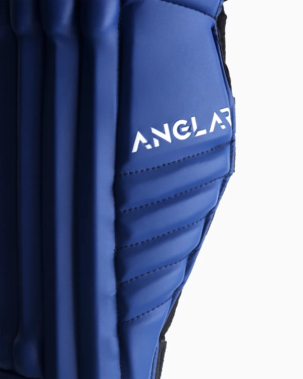 Side closeup view of blue ANGLAR cricket batting pad with protective ridges